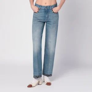 Jeans blu slavato con bordi in tessuto floreale