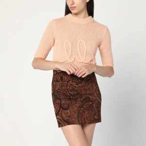 Maglia color pesca con ricamo logo